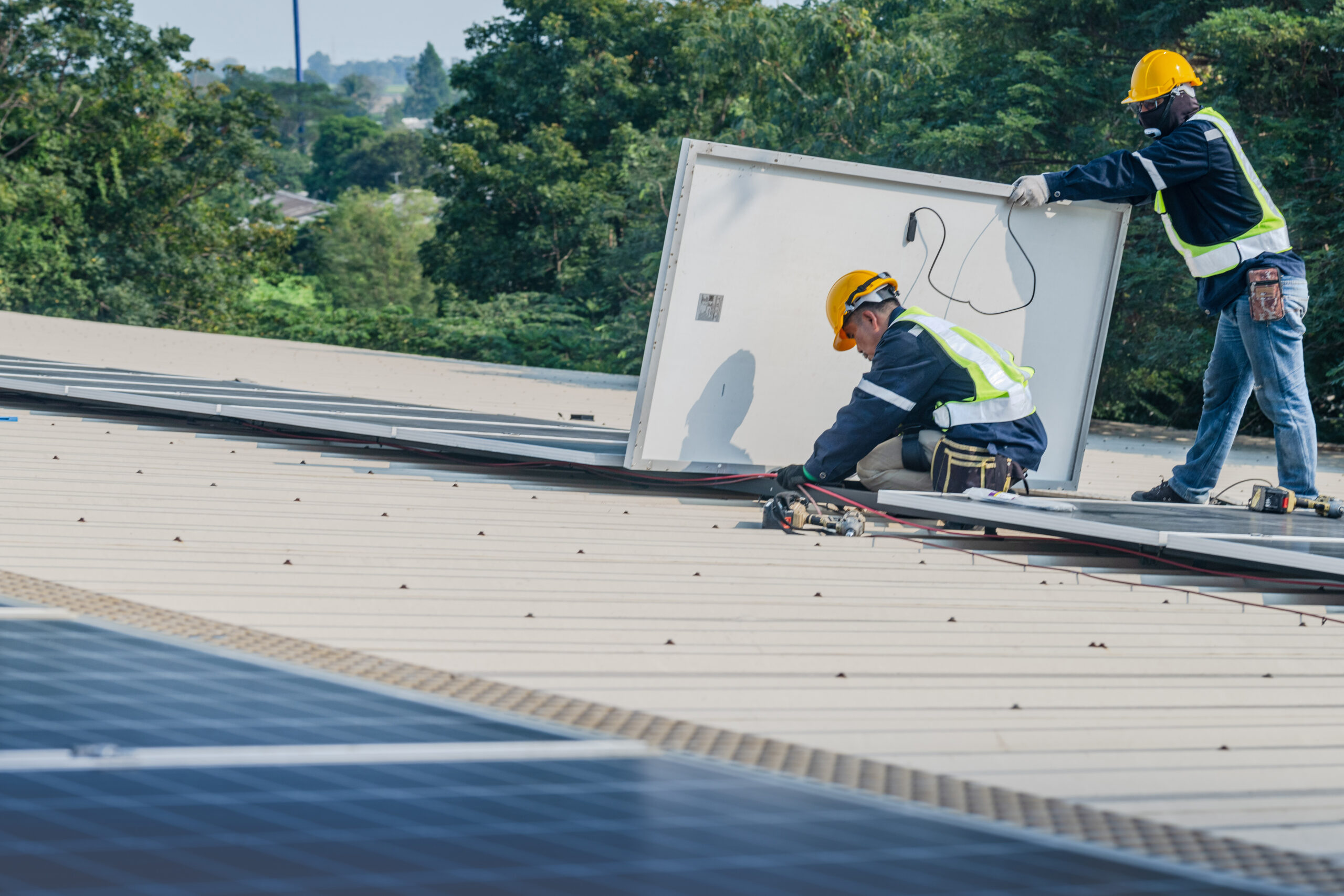 Worker Technicians are working to construct solar panels system