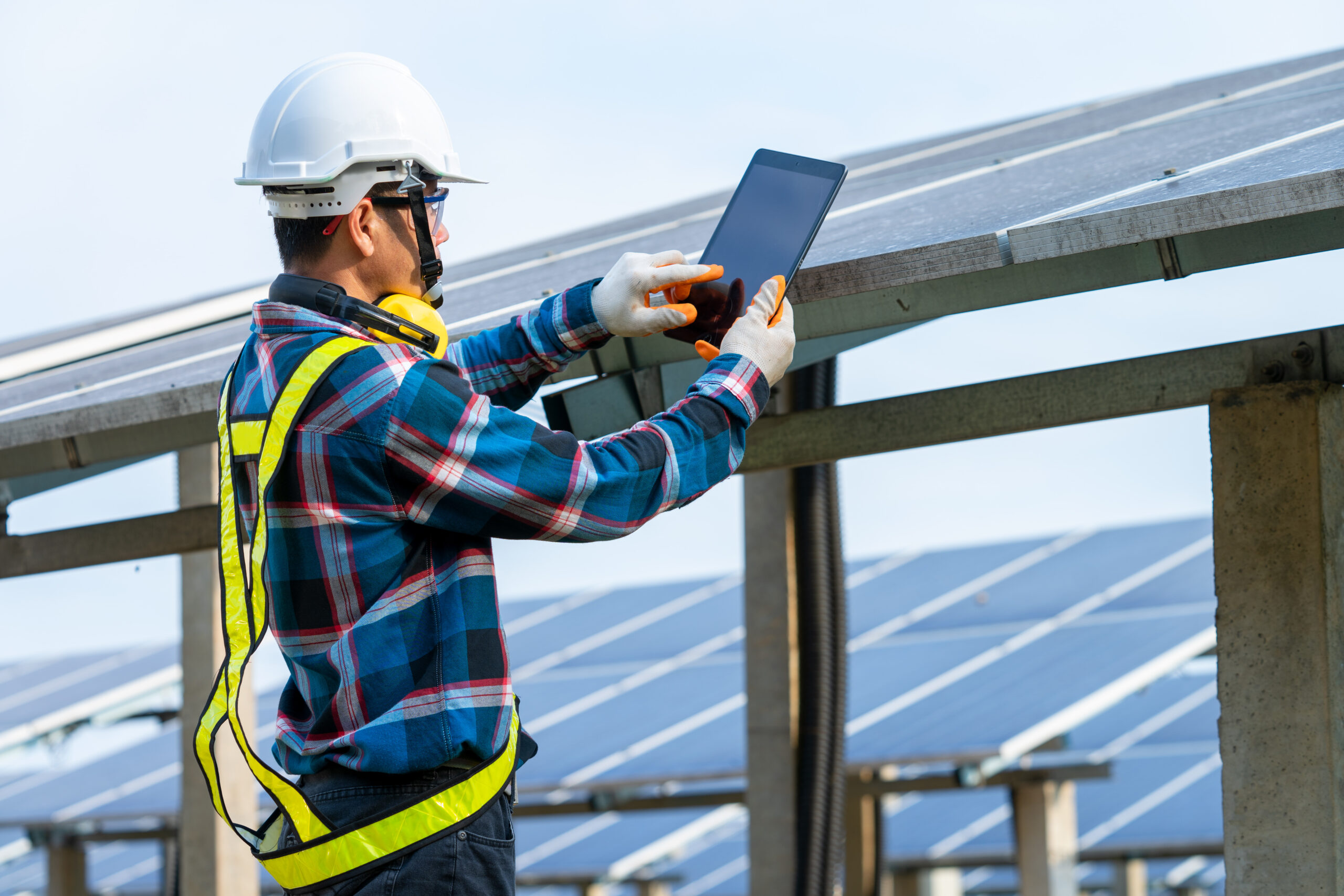 Engineer working on checking equipment in solar power plant,Clim